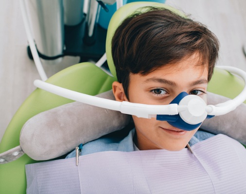 Relaxed patient with nitrous oxide sedation dentistry mask