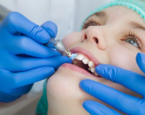 Child receiving fluoride treatment