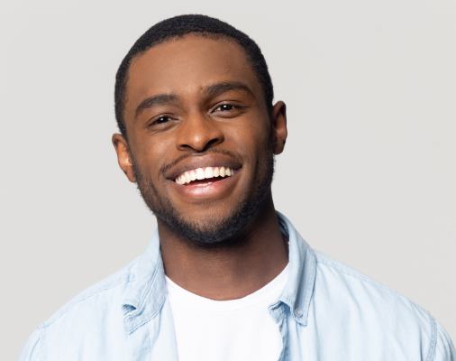Man with bright smile after teeth whitening