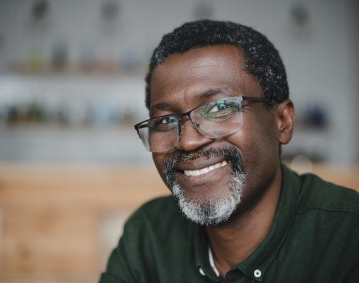 Man with dentures smiling