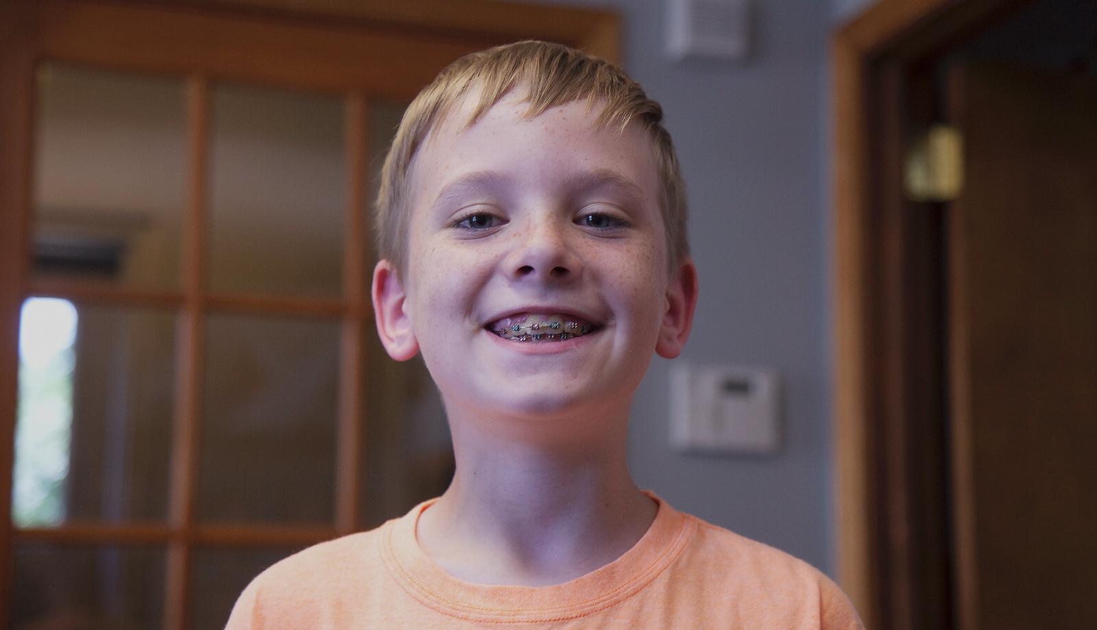 Smiling young boy with braces in Mount Holly
