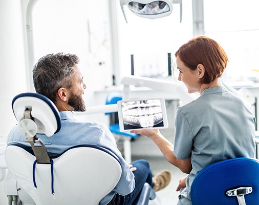 patient talking to dentist 