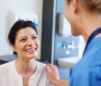 Woman smiling at dentist