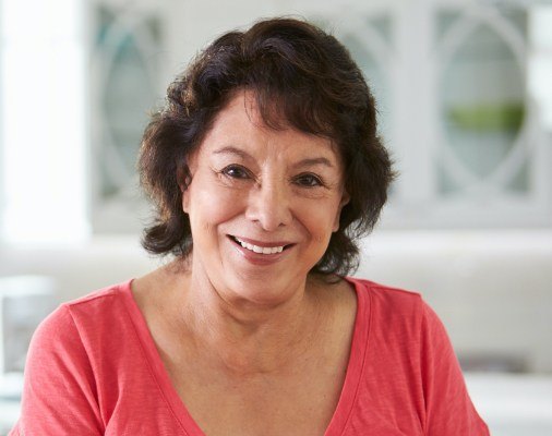 Woman with dental implant supported restoration smiling