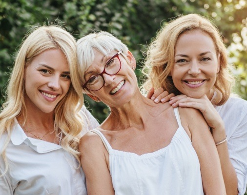 Three women with gorgeous smiles after makeovers