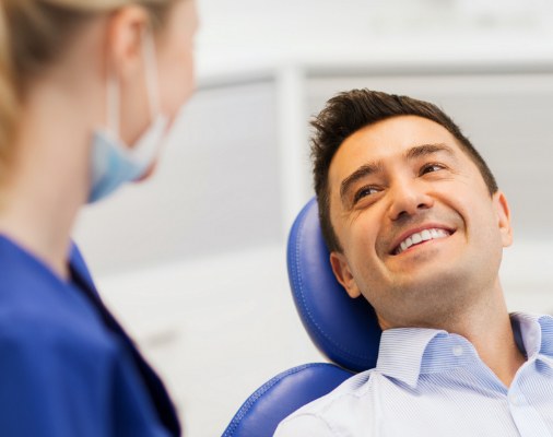 Man smiling during preventive dentistry checkup and teeth cleaning