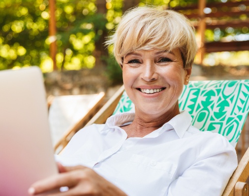 Woman smiling after root canal therapy