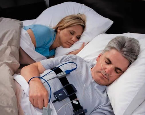 Man taking an at home sleep apnea study