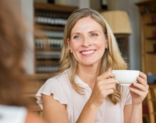 Woman with bright smile after teeth whitening