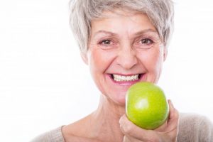 woman smiling apple