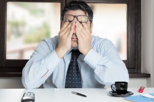 tired man at desk