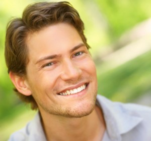 man with a great smile after he stopped smoking and whitened teeth