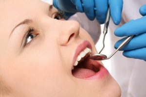 woman receiving care from dentist