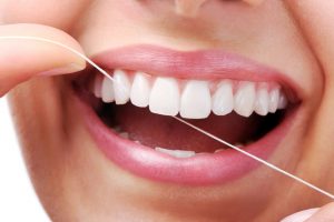 Daily flossing wards off decay and gum disease. Learn reasons behind this oral hygiene habit and how to best do it from your Mt. Holly dentists. 